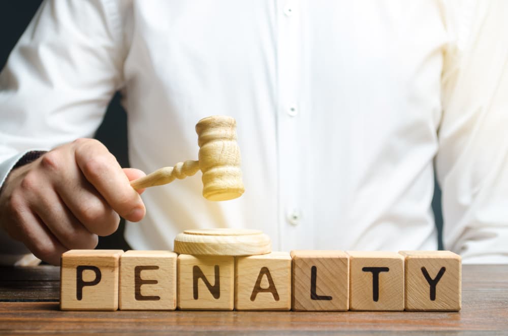 Penalty wooden blocks and Attorney with hammer in background